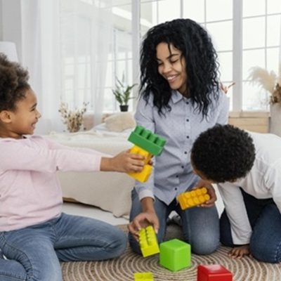 front view happy mother playing home with her children
